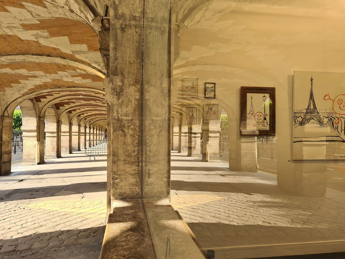 Stone arcades of Place des Vosges with framed artworks visible inside the gallery